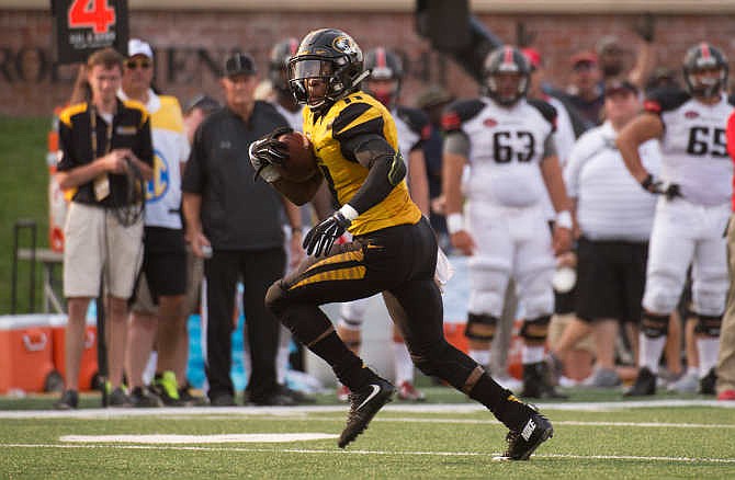 Missouri's Aarion Penton returns a blocked punt for a touchdown during the third quarter of an NCAA college football game against Southeast Missouri State Saturday, Sept. 5, 2015, in Columbia, Mo. 