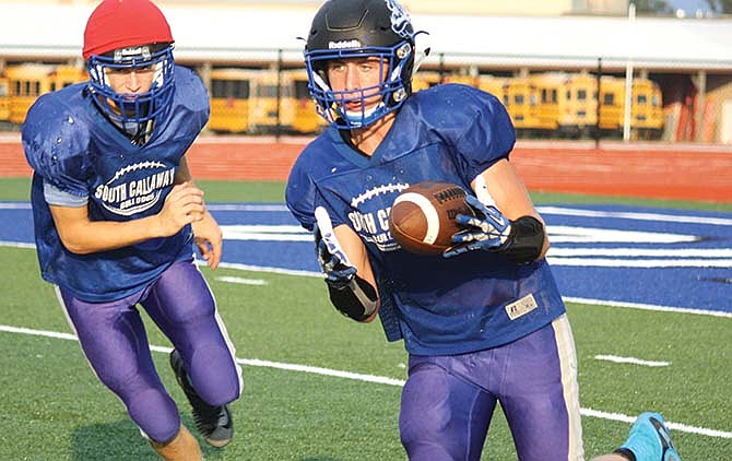 South Callaway senior running back Cameron Richardson heads upfield
after taking a pitchout in Tuesday afternoon's practice.