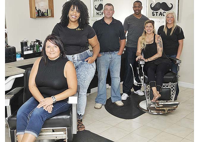 Barber Mechanics on Broadway employees are owner Katherine Wakefield, ethnic hair specialist
Alicia Edwards-White, massage therapist Kendall Job, Ameir Smith, Christina Anderson,
seated, and Jessie Kempker.