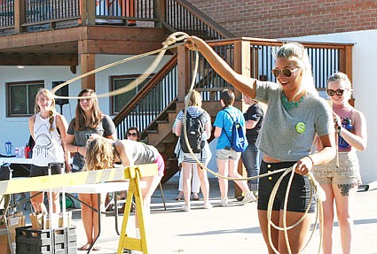 Caeli Dudenhoeffer a sophomore at William Woods University attempts to throw a lasso at the Student Activities Fair Thursday. The William Woods Western Club puts on events for the university's equine department.