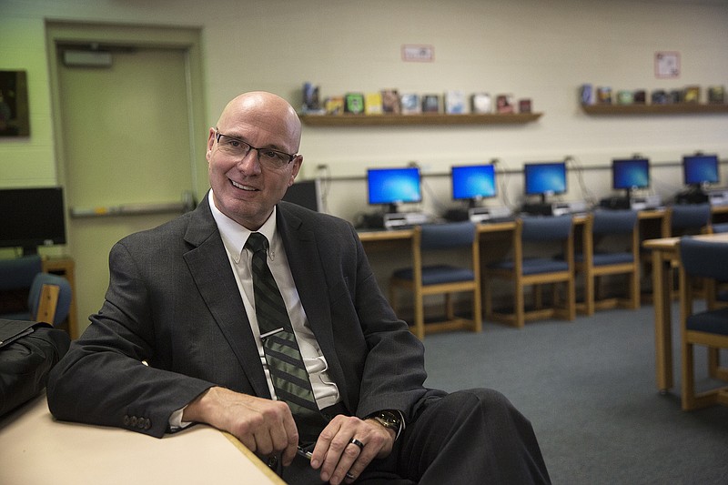 Blair Oaks girls basketball coach Kevin Kohler sits in the high school library Thursday in Wardsville.