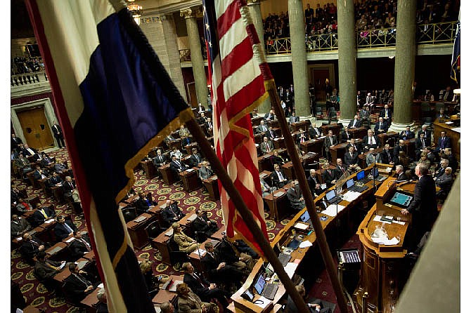 In this News Tribune file photo, Gov. Jay Nixon takes the dais in the Missouri House chambers before delivering the 2014 State of the State address before a joint session of the Missouri Legislature. Wednesday marks the beginning of the 2015 veto session with 16 veto overrides to consider.