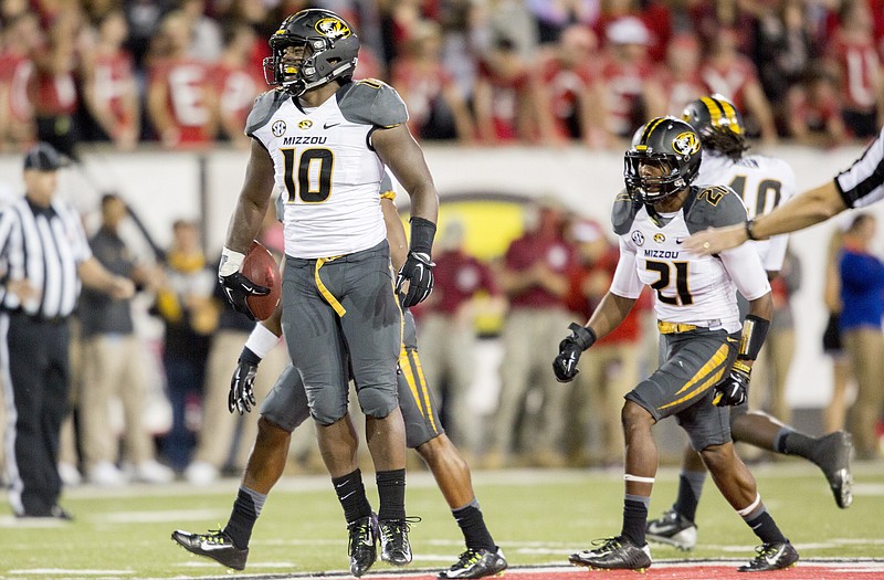 Missouri linebacker Kentrell Brothers (10) celebrates after one of his interceptions in the second half of Saturday night's game against Arkansas State in Jonesboro, Ark.