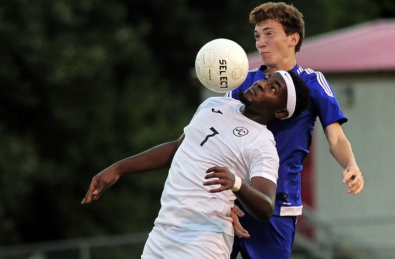 Jefferson City midfielder Romando Thomas battles Quincy defender Collin Burgtorf for possession of the ball in the Jays' half of the field in the first half of Wednesday's match at 179 Soccer Park.