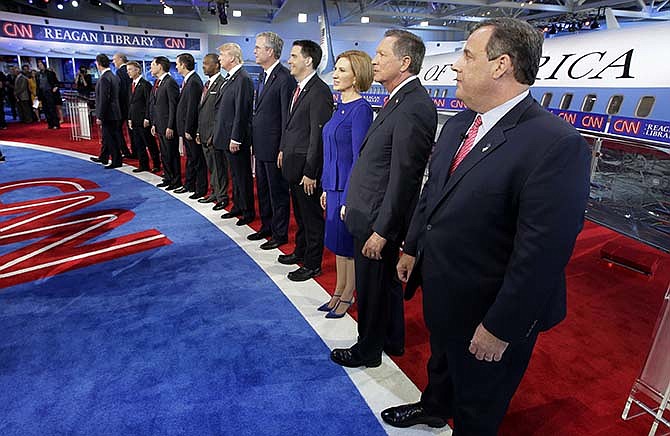 Republican presidential candidates, from left, former Pennsylvania Sen. Rick Santorum, former New York Gov. George Pataki, Sen. Rand Paul, R-Ky., former Arkansas Gov. Mike Huckabee, Sen. Marco Rubio, R-Fla., Sen. Ted Cruz, R-Texas, retired neurosurgeon Ben Carson, businessman Donald Trump, former Florida Gov. Jeb Bush, Wisconsin Gov. Scott Walker, businesswoman Carly Fiorina, Ohio Gov. John Kasich, and New Jersey Gov. Chris Christie take the stage during the CNN Republican presidential debate at the Ronald Reagan Presidential Library and Museum on Wednesday, Sept. 16, 2015, in Simi Valley, Calif.