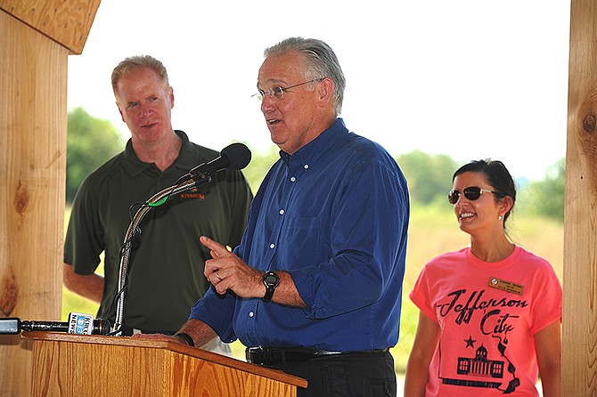 During a press conference Thursday recognizing the 25th anniversary of the Katy Trail, Gov. Jay Nixon, middle, announced the trail's 47.5-mile extension. The new stretch will run from Windsor to Pleasant Hill which is located in central western Missouri. He was flanked by Bill Bryan, director of Missouri State Parks, left, and Jefferson City Mayor Carrie Tergin.