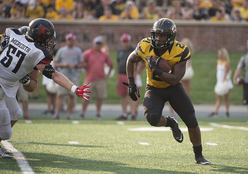 Missouri running back Ish Witter runs past Southeast Missouri State's Chad Meredith during a game earlier this month at Faurot Field.