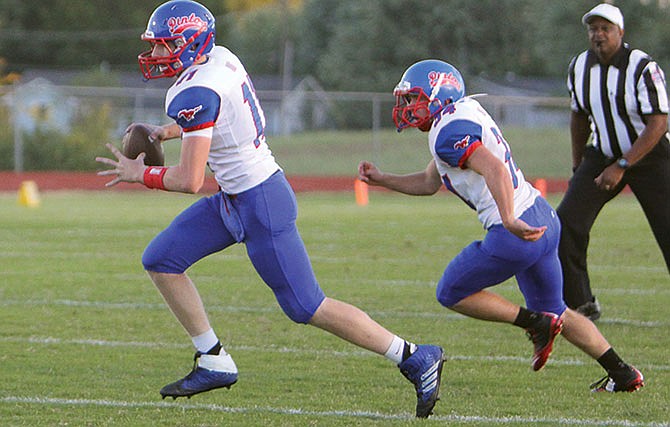 
California quarterback Jacob Wolken and running back Gunner Baquet rung the option during the first half of last
week's game against Eldon.