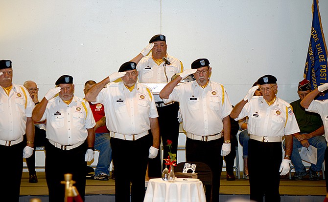 Thomas A. Ward, center, salutes with fellow members of VFW Post 1003 to honor Vietnam veteran Paul Hasenbeck during POW-MIA Recognition Day Friday at the Capitol Rotunda. Hasenbeck was reported missing in action on April 21, 1967, in the Quang Tri Province, South Vietnam. 