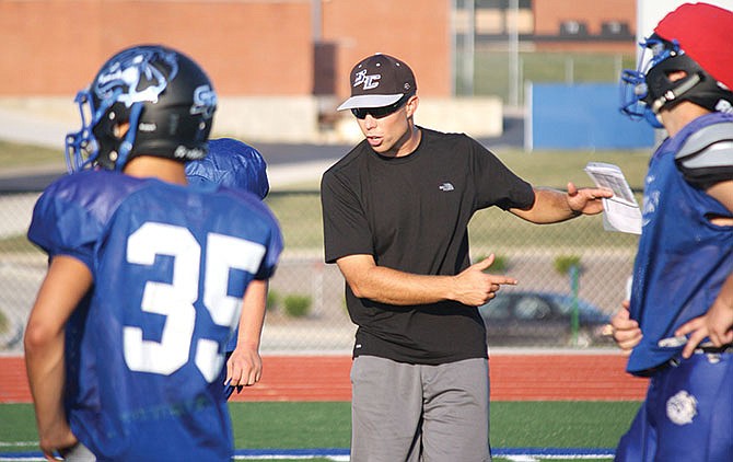 South Callaway offensive coordinator Tucker Bartley instructs players during a drill in practice this week at the high school in Mokane, Mo.