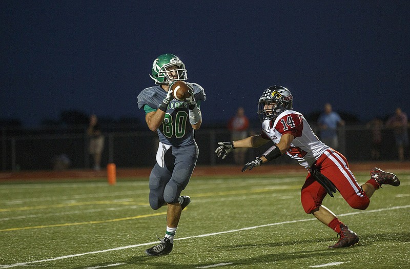 Blair Oaks receiver C.J. Closser makes a catch over his defender before running for a touchdown Friday in the Falcons' game against Southern Boone at the Falcon Athletic Complex.