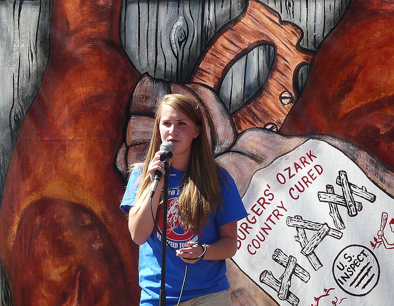 Pinto Express member Alyssa Sabartinelli sings "The Fight Song" on the North Stage at the 25th annual Ozark Ham and Turkey Festival.
