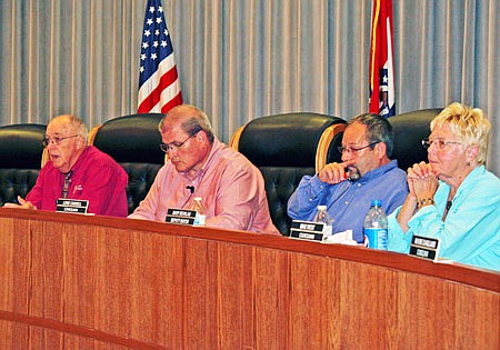 In this file photo, Fulton Mayor LeRoy Benton (far left) speaks to the near-capacity gallery at the Sept. 8 city council meeting as City Administrator William Johnson and Ward 2 Councilmembers Lowe Cannell and Mary Rehklau listen. At its subsequent Sept. 29 meeting, the council heard of new city tax proposals.
