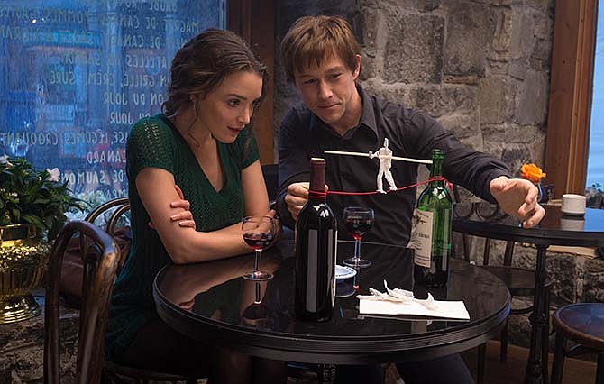 This photo provided by Sony Pictures Entertainment shows Charlotte Le Bon, left, as Annie and Joseph Gordon-Levitt as Philippe Petit in a scene from TriStar Pictures' "The Walk." "The Walk," is a fictionalized rendering of Philippe Petit's 1974 high-wire stroll between the World Trade Center towers. 