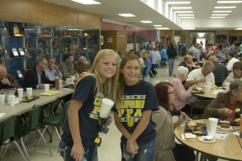At the California Chapter FFA Barbecue Sunday, Oct. 4, FFA members Grace Henley and Karly Wolfe are ready to help patrons of the FFA barbecue Sunday.