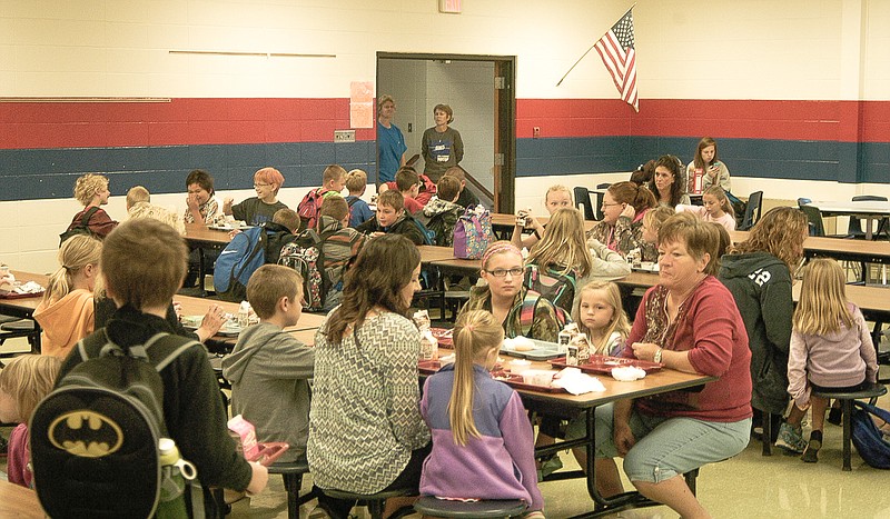 The California Elementary Cafeteria is filled with students and family for breakfast on the "Muffins for Moms" day.