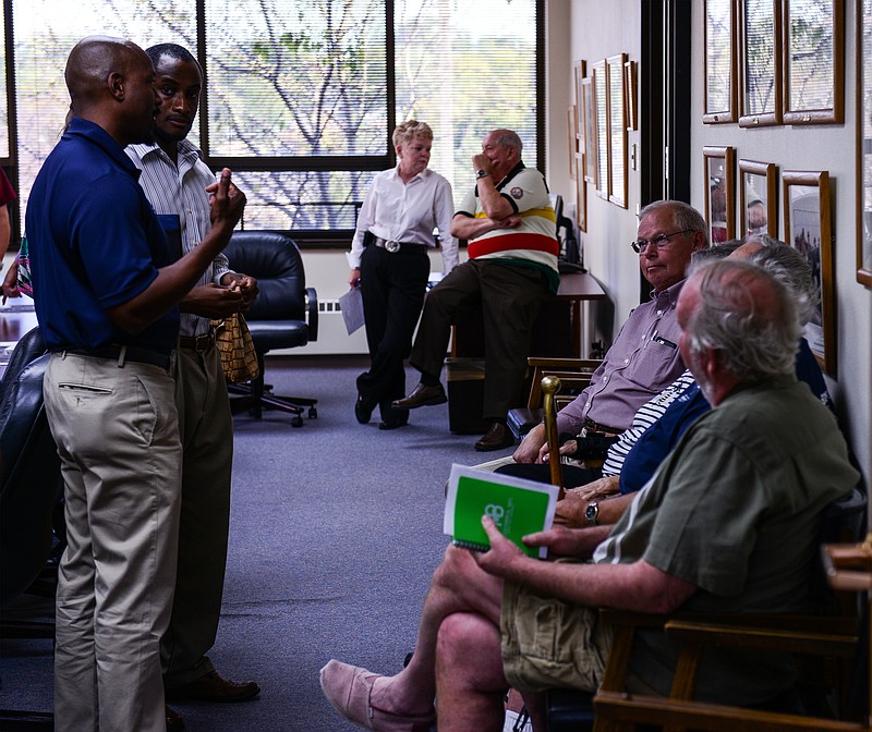 Concerned citizens and nearby residents discuss the possibility of vacating the 700 block of Chestnut Street Thursday. Plans would allow Lincoln University to close off the street and designate a pedestrian plaza in the same area.