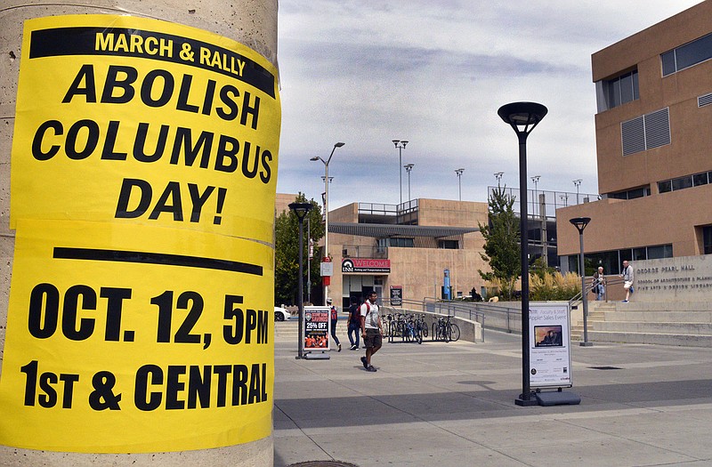 A flyer on the campus of the University of New Mexico in Albuquerque calls for students to join a protest against Columbus Day.Today marks the annual Columbus Day nationwide, but in a twist that signals a growing trend, it will also be Indigenous Peoples Day in at least nine U.S. cities this year. 