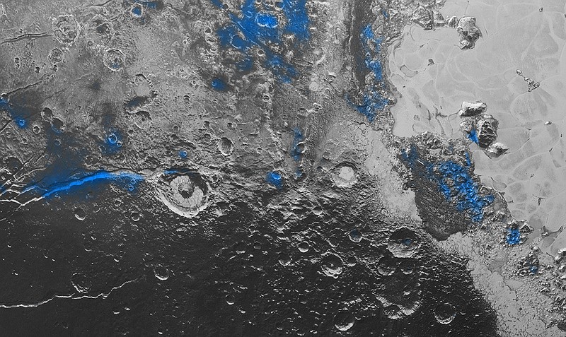 This image released by NASA shows regions with exposed water ice highlighted in blue in this composite image taken with the New Horizons spacecraft's Ralph instrument. The image combines visible imagery from the Multispectral Visible Imaging Camera (MVIC) with infrared spectroscopy from the Linear Etalon Imaging Spectral Array (LEISA).
