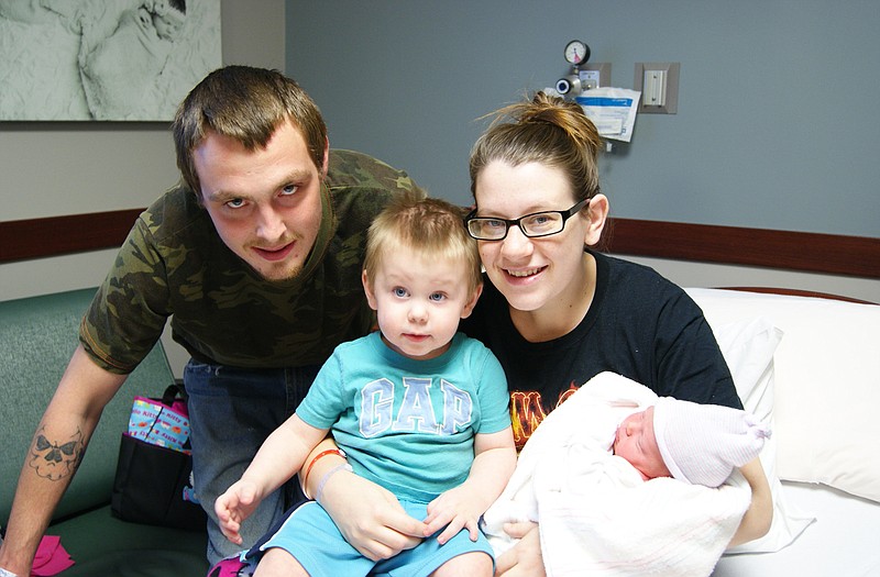 Parents Darrell Wilhite and  Brittany Wynkoop with 20-month-old Hunter Wilhite and roadside baby  Elaina Wilhite at Capital Region Medical Center on Monday.
