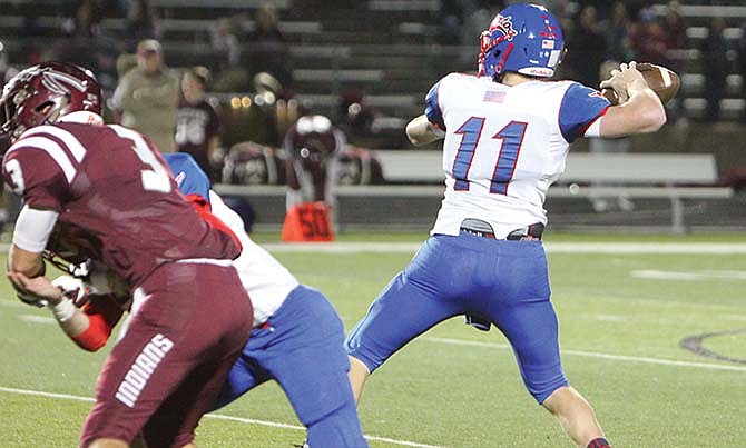 
California quarterback Jacob Wolken prepares to make a throw during last Friday night's game against School of
the Osage.