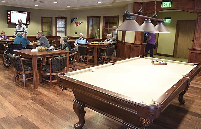 Primrose Retirement Community hosted an open house Thursday for the grand opening
of its Jefferson City location off Old Lohman Road. Primrose president BJ Schaefbauer
led tours of the facility, including through the very popular pub, shown here.