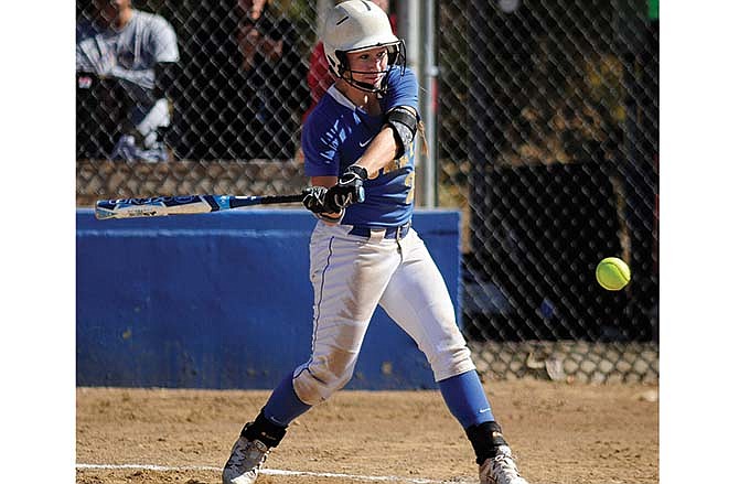 
Fatima's Sammey Bunch steps into a pitch and blasts a solo home run to left-center field during the fourth inning of Saturday's quarterfinal game against Centralia at Lions Field in Westphalia.