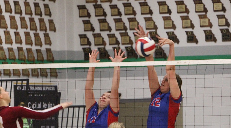 Adrienne Strickfaden (No. 12) making the block and Gracie George (No. 17) is to the left for help. 