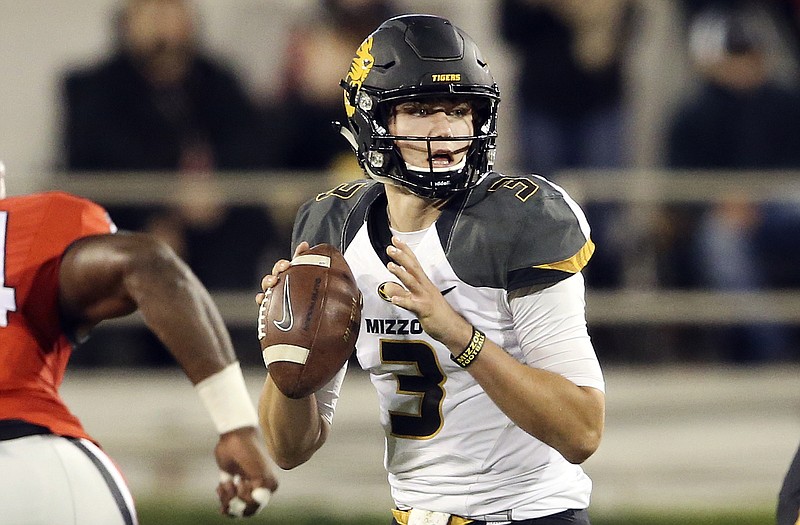 Missouri quarterback Drew Lock (3) drops to pass in the first half of an NCAA college football game against the Georgia Saturday, Oct. 17, 2015, in Athens, Ga.