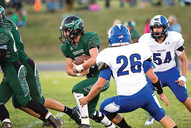 North Callaway senior running back Tyler Mattes follows a pair of blockers during a game earlier this season against Montgomery County.