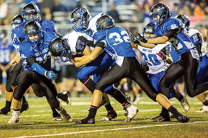 South Callaway linebacker Dakota Kraft wraps up Mark Twain's Bradyn Hooley during a game earlier this month in
Mokane.