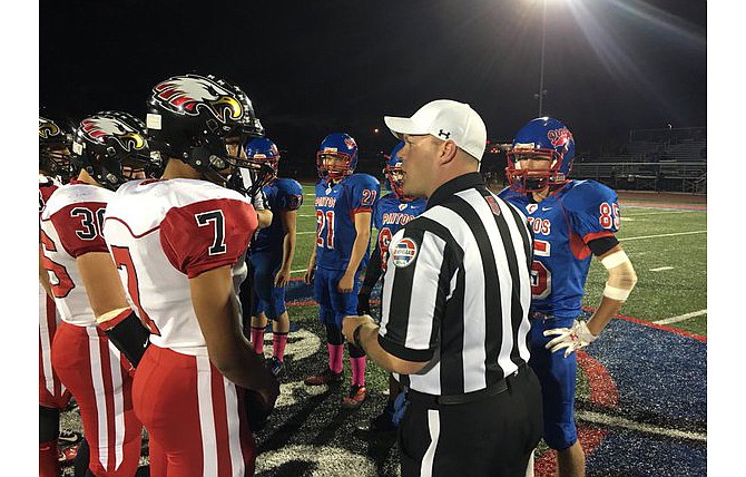 Southern Boone calls the coin toss correctly at the start of Friday night's district playoff game but elects to kick off to the California Pintos. The Eagles won the contest 48-21.