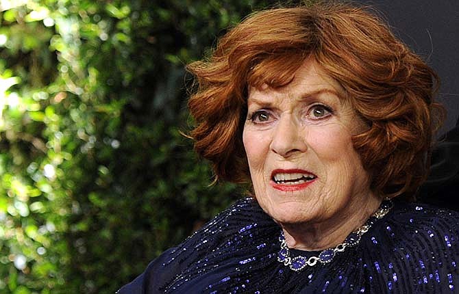 This Nov. 8, 2014 file photo Maureen O'Hara arrives at the 6th annual Governors Awards at the Hollywood and Highland Center in Los Angeles. O'Hara,who appeared in such classic films as "The Quiet Man" and How Green Was My Valley," has died. Her manager says O'Hara died in her sleep Saturday, Oct. 24, 2015 at her home in Boise, Idaho.