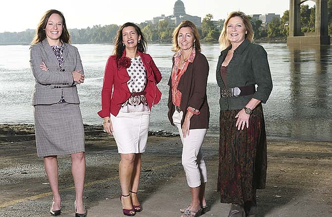From left, Erin Wiseman, Carrie Tergin, Lisa Mankin and Mary Kay Kempker are featured on the cover of #jcmo Inside Business for Fall 2015. They're four of 15 Jefferson City area business women profiled in the 15 in '15 feature.