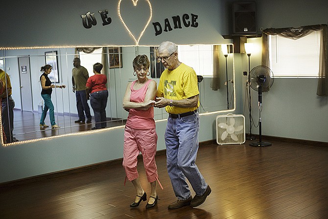 A couple dances during a Steppin' Out Dance Studio class. Classes are offered for both beginner and intermediate levels of multiple types of dance. 