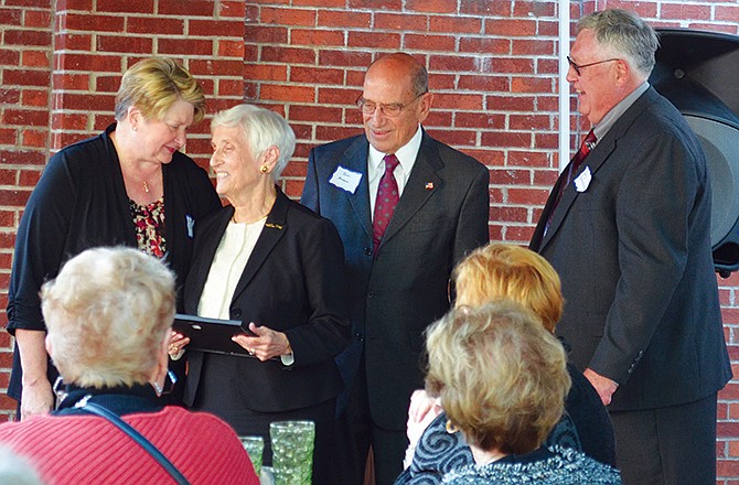 At center, Roberta and Robert Herman accept the Hope Award from the Cole County Historical Society at the organization's annual meeting Sunday.