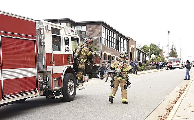 
Jefferson City firetrucks were parked on Chestnut Street as Sruggs Center on the campus of Lincoln University was evacuated Friday after smoke was reported on the second floor of the building. It was determined later there was a fire in an HVAC motor on a unit on the roof.