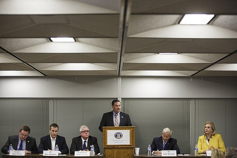 Sen. Mike Kehoe introduces the panel of candidates in the Missouri gubernatorial forum at the Farm Bureau Headquarters Tuesday evening. They are, from left, Sen. Bob Dixon, Eric Greitens, Lt. Gov. Peter Kinder, John Brunner, and former Missouri Speaker of the House Catherine Hanaway. 