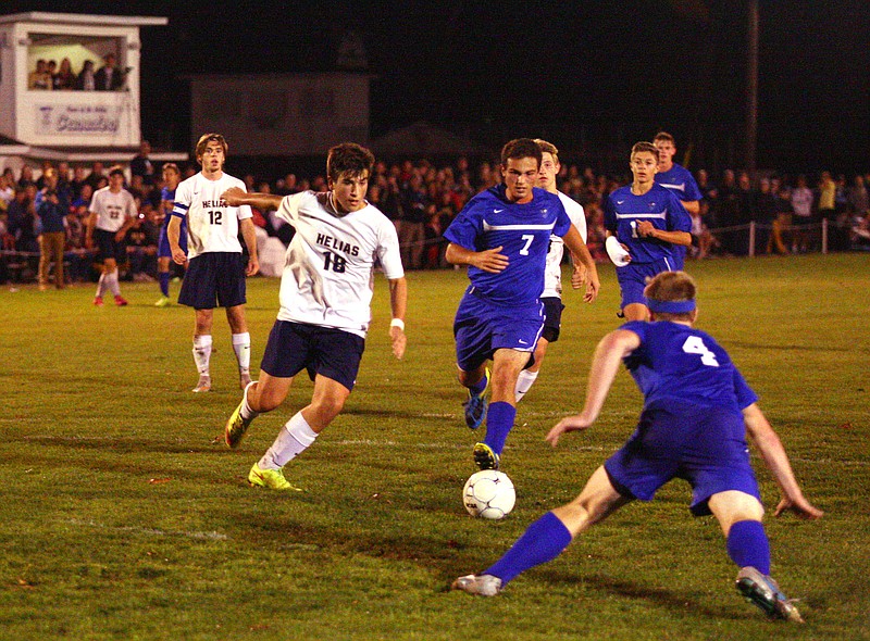 Arris Pardalos of Helias works his way through the Marshfield defense during Tuesday night's Class 3 sectional contest at the 179 Soccer Oark.