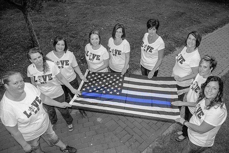 Wives of California Police officers met at the Moniteau County Courthouse in August to take this picture showing their support for their husbands.