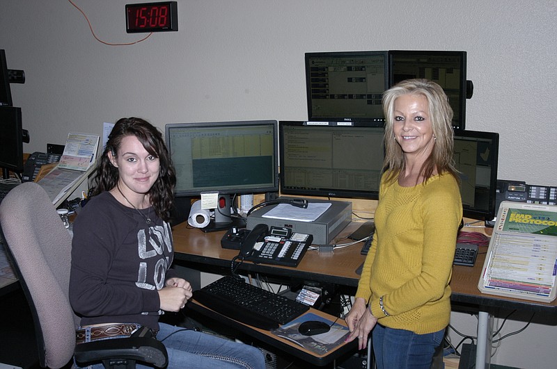 Shelby Barnett, left, and Becky Forsythe are two of the dispatchers at the Moniteau County Emergency 911 Dispatch Center.  
