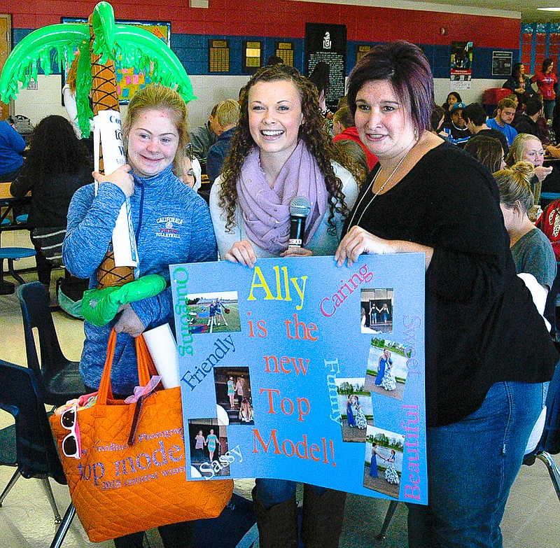 California High School Senior Ally Meisenheimer is surprised with the information that she is the Amy Knollmeyer Photography Studio Top Model for 2015. Pictured, from left, are Top Model winner Meisenheimer, Runner-up Lauren Ziehmer and Photographer Amy Knollmeyer.