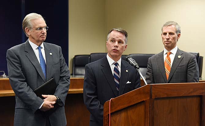 Flanked by Missouri Gov. Jay Nixon, left, and Missouri Highways and Transportation Commission Chairman Stephen R. Miller, listen as Patrick K. McKenna, the state's new Department of Transportation director, answers questions during a press conference, Thursday, Nov. 5, 2015, in Jefferson City. McKenna, who previously served as deputy commissioner of the New Hampshire Department of Transportation, was selected from about two dozen candidates seeking the position.
