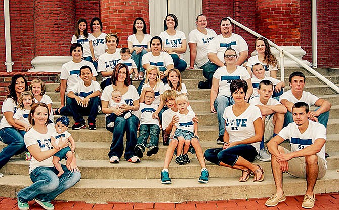 Wives and families of California, Mo., police officers met at the Moniteau County Courthouse in August to take this picture showing their support for their husbands and fathers.