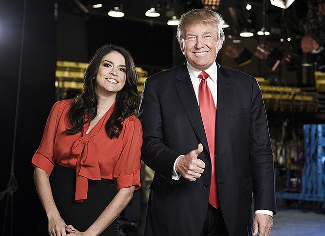 This Tuesday photo shows Cecily Strong, left, and Donald Trump from the episode "Donald Trump" on "Saturday Night Live." Pressure continued to mount on NBC to cancel Trump's guest-host appearance on this weekend's "Saturday Night Live" as a coalition of advocacy groups delivered petitions to the network Wednesday, calling for him to be dropped from the show.