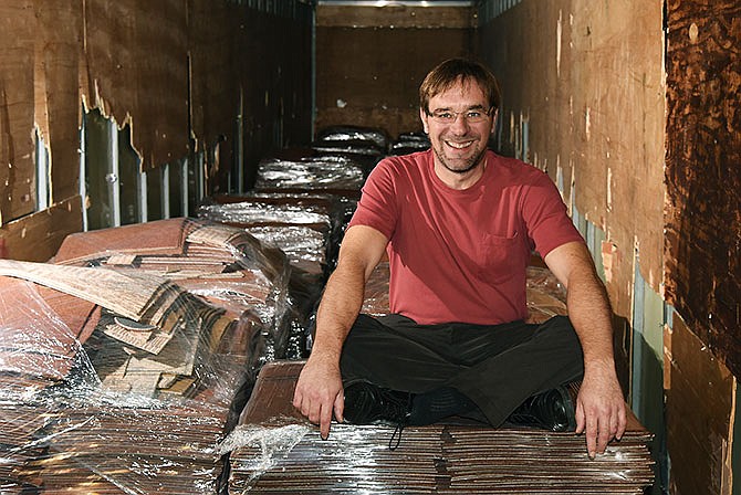
Rob Didriksen sits atop soon-to-be-recycled carpet tiles
from the Truman Building in Jefferson City where his office as Missouri's state
recycling coordinator is located.