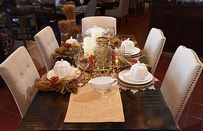 Mixing patterns, such as clear or amber glass with basic white dishes, makes for a more interesting table, as seen at Pier 1.