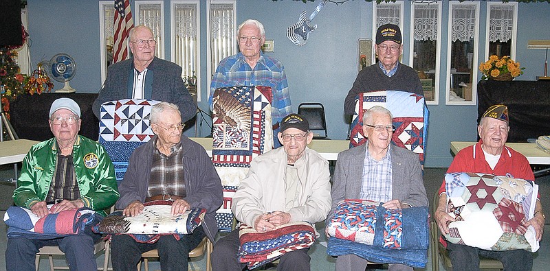 World War II veterans receiving quilts at the presentation ceremony are: front row, from left, Lawrence Gaston, Paul Birdsong, Leroy Henry, Edward West, Van Williamson; back row, Robert "Bob" Elliott, John Evans and Charles Foster. Melvin Peterman was unable to be present for the presentation.