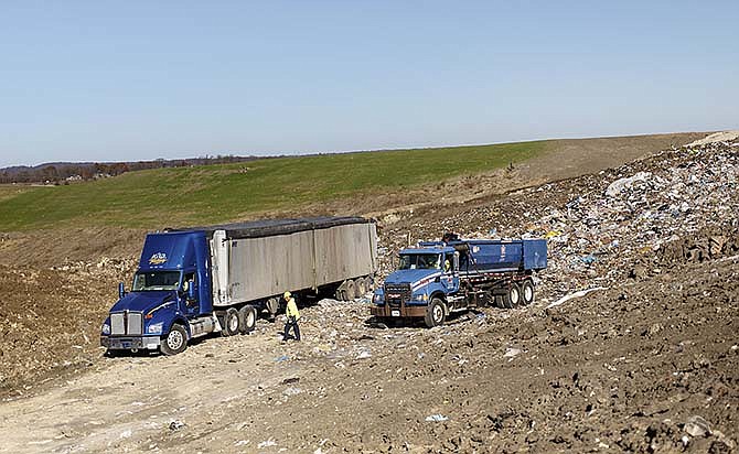 Trucks dump trash at edge of the Allied Waste landfill in Jefferson City. 