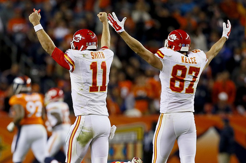 Chiefs quarterback Alex Smith and tight end Travis Kelce celebrate a touchdown during the fourth quarter of Sunday's game against the Broncos in Denver.